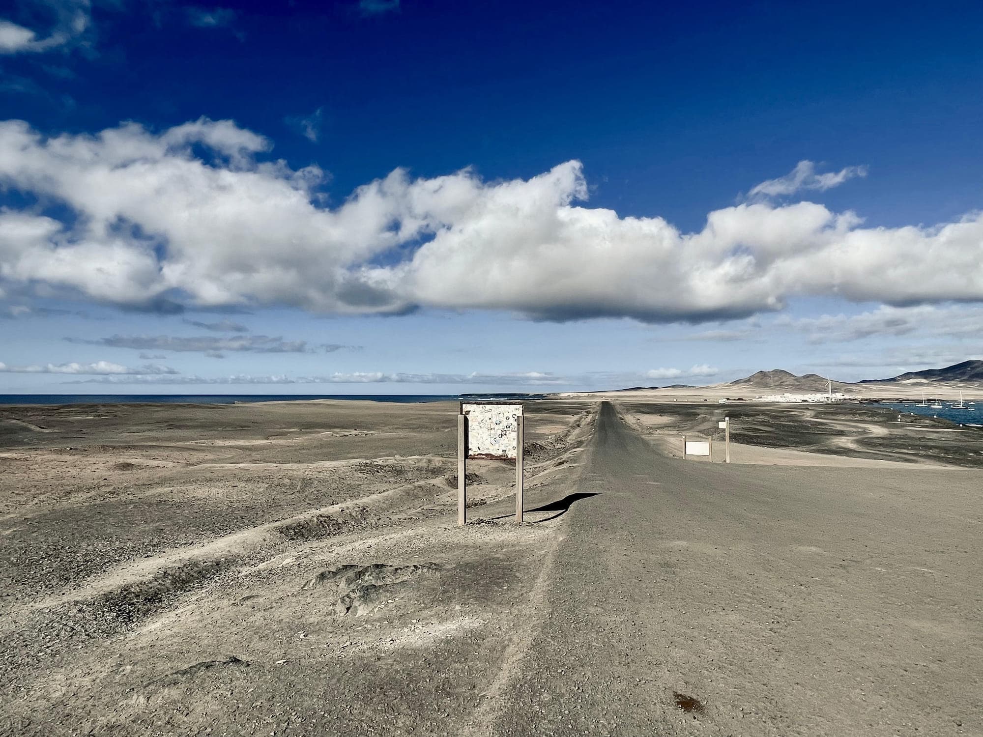 Desert road leading to the ocean