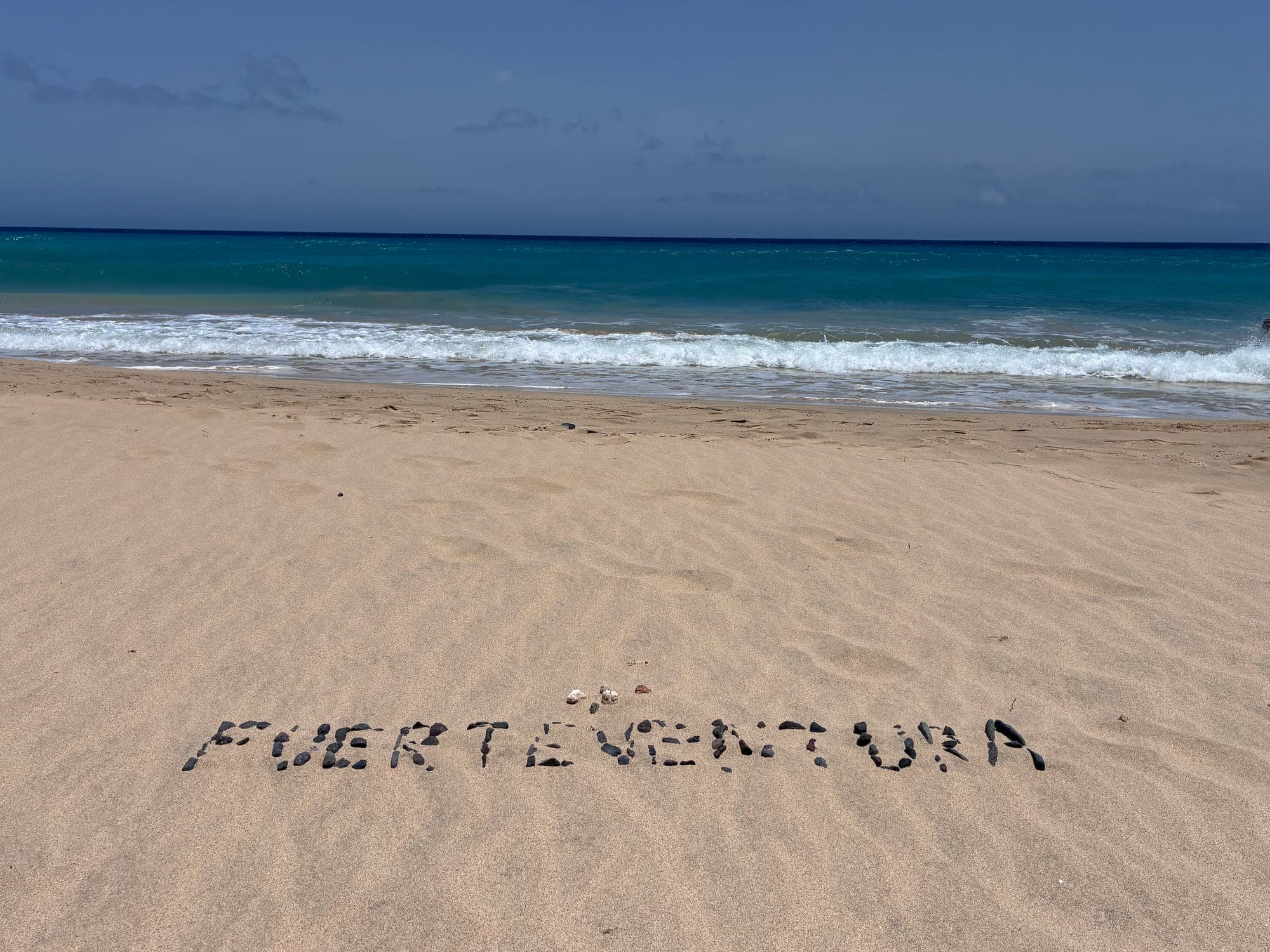 Fuerteventura spelled in stones on the beach