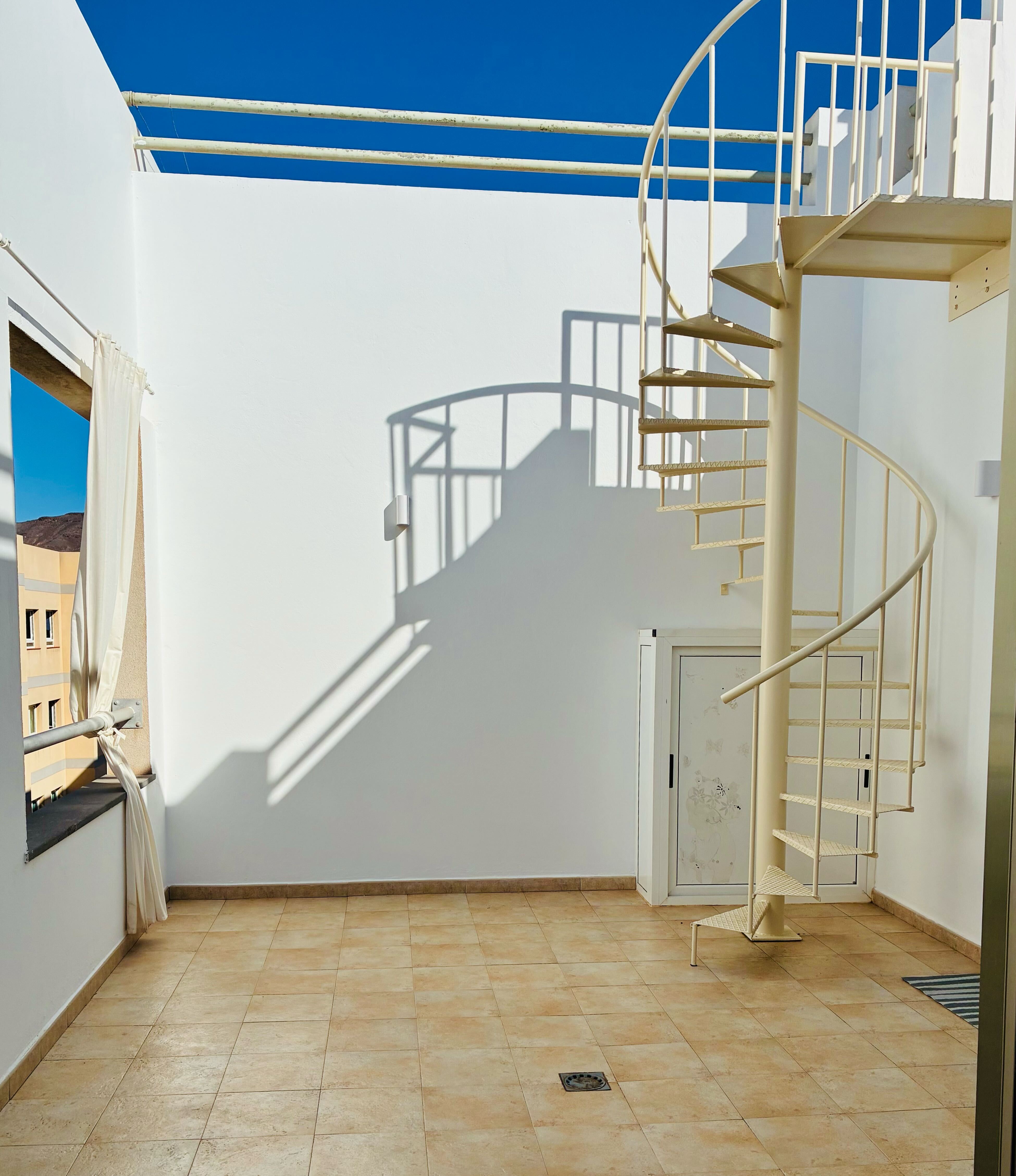 Bluebird Home terrace with spiral staircase
