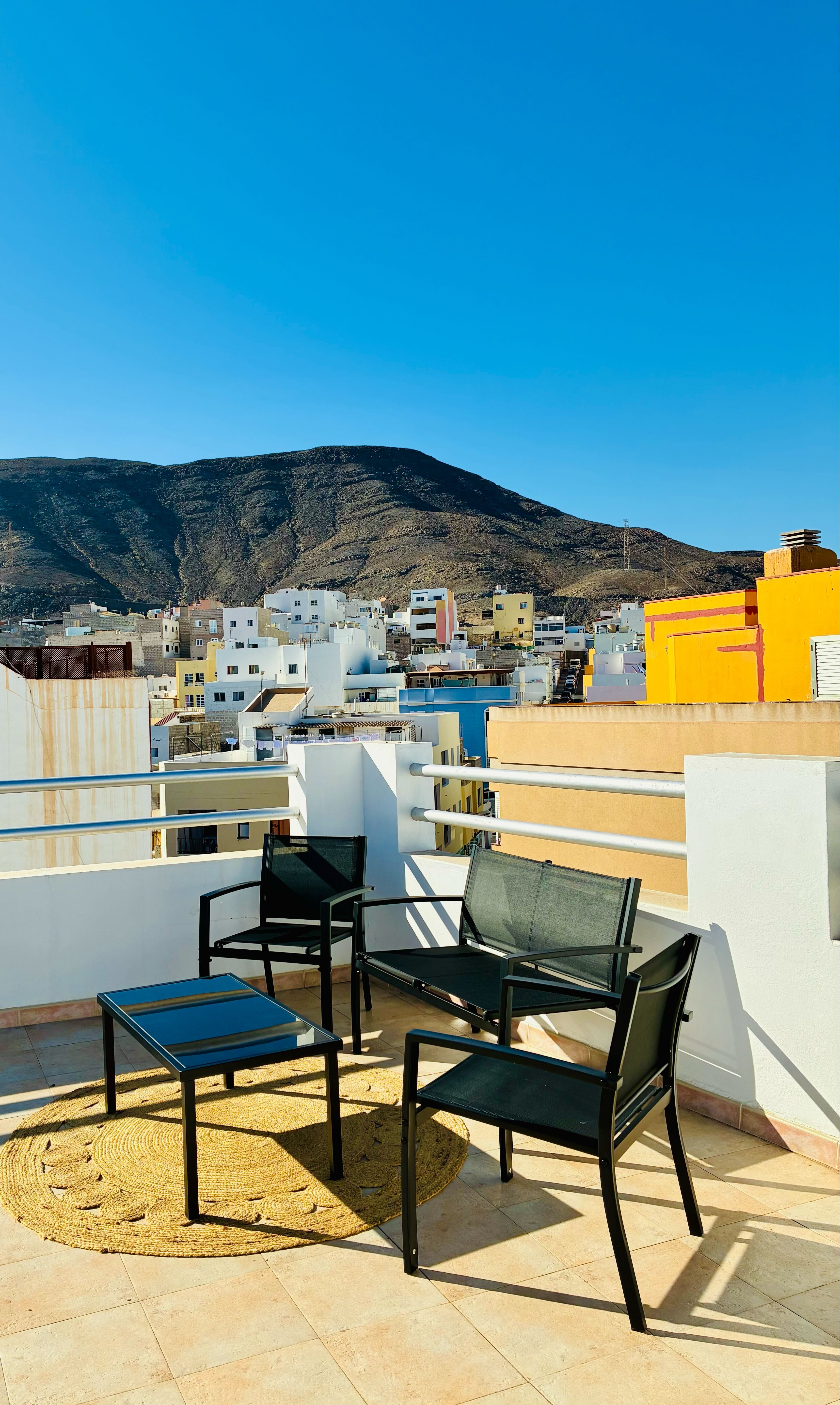 Bluebird Home rooftop seating with mountain view